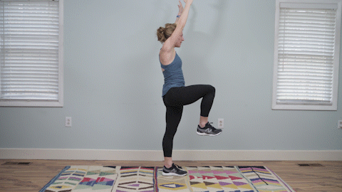 A runner demonstrates a hip hinge exercise as part of a strength workout for runners