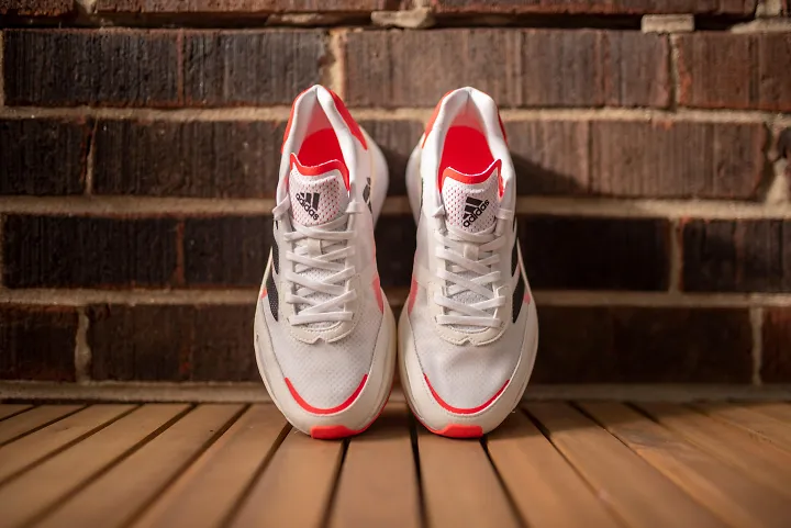 A pair of adidas running shoes in white