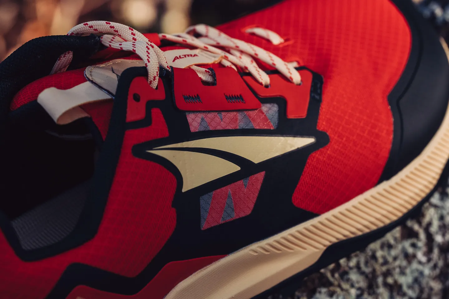 The red upper of the men's Altra Lone Peak 7.