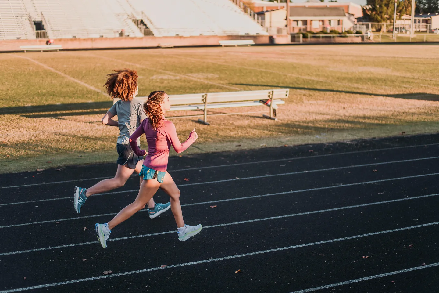 Two runners on a track.