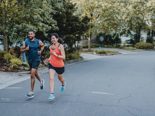 Runners with energy gels smile on their run.