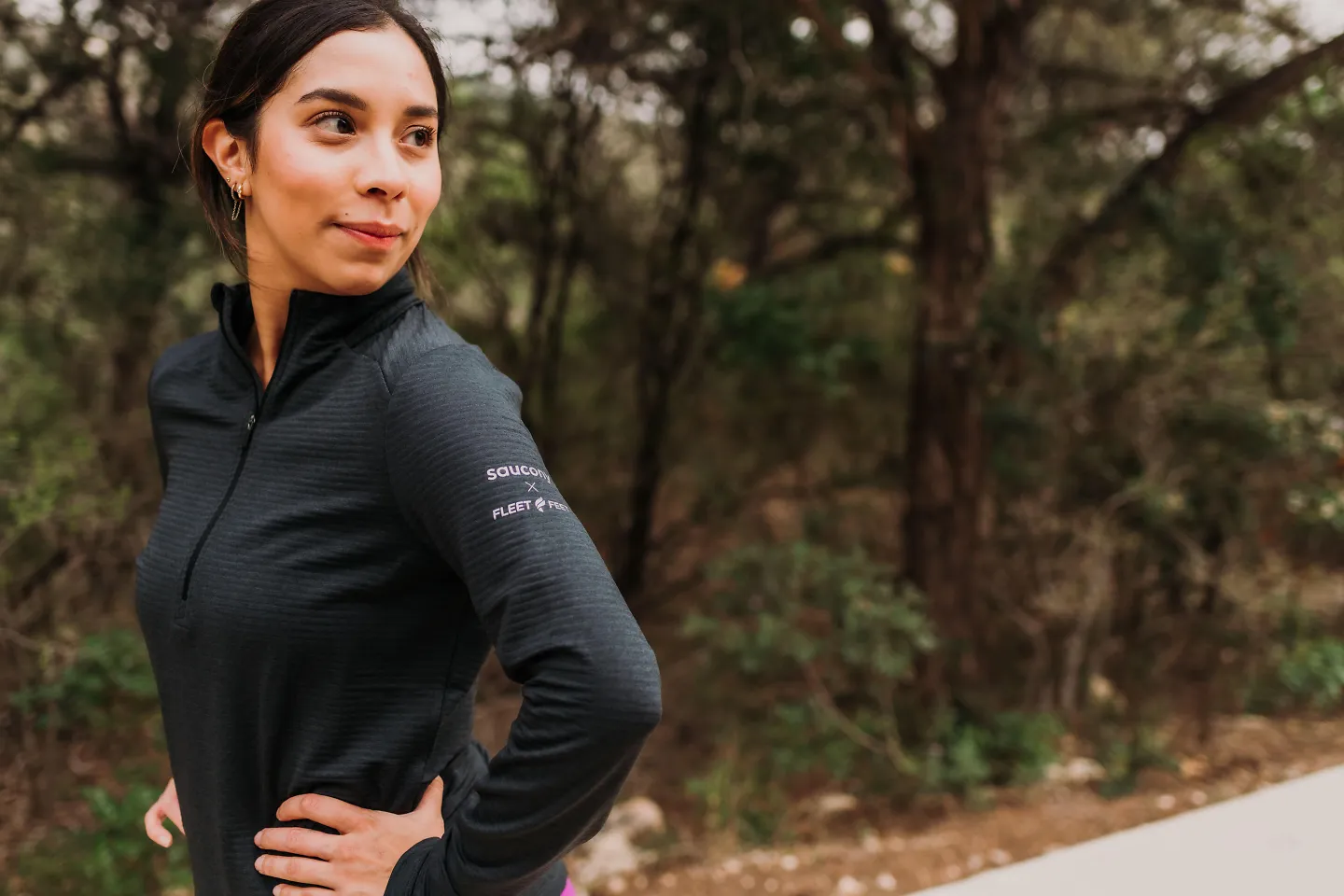 A runner smiles over her shoulder.