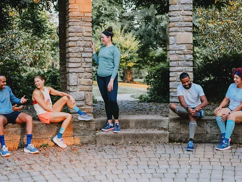 A group of runners gather before they run.