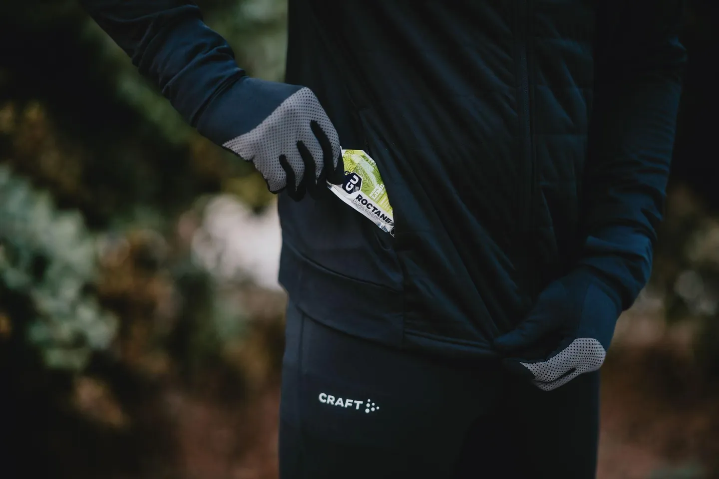 A runner pulls a GU energy pack out of his pocket. 