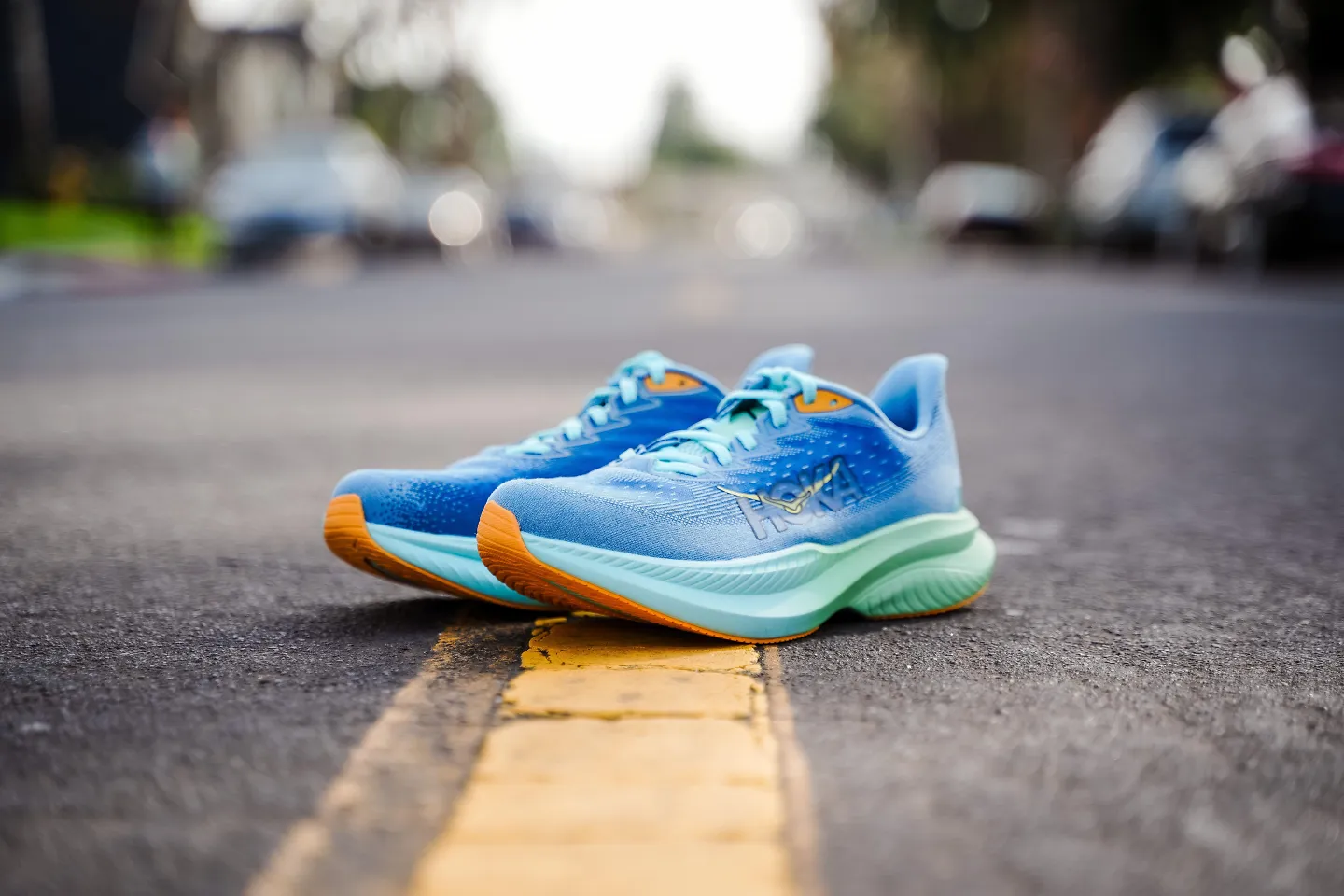 The HOKA Mach 6 sits on the road.