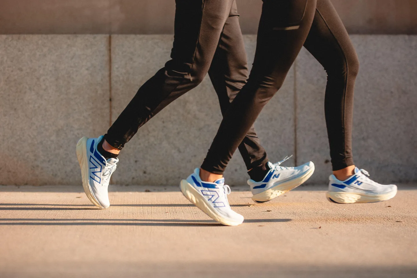 Two runners run side by side in pairs of the New Balance 1080 v13.
