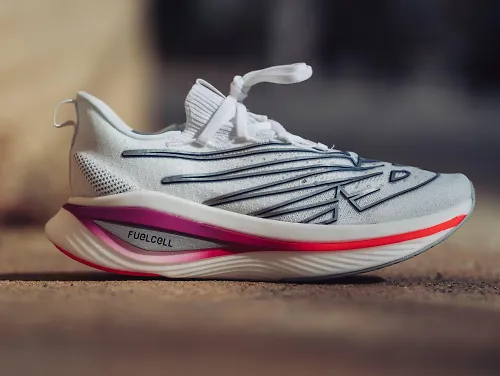 A side profile view of the New Balance FuelCell SC Elite v3. 