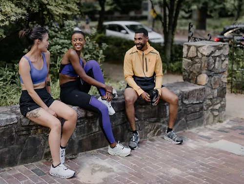 A group of runners sit together after a long run.