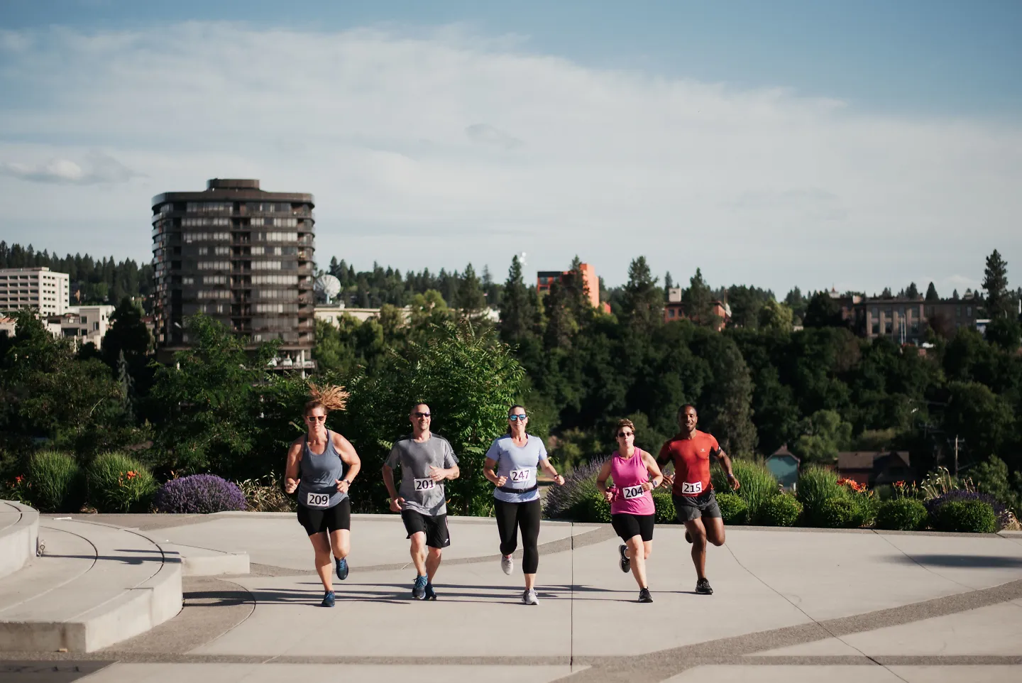 A line of runners stick together during a race.