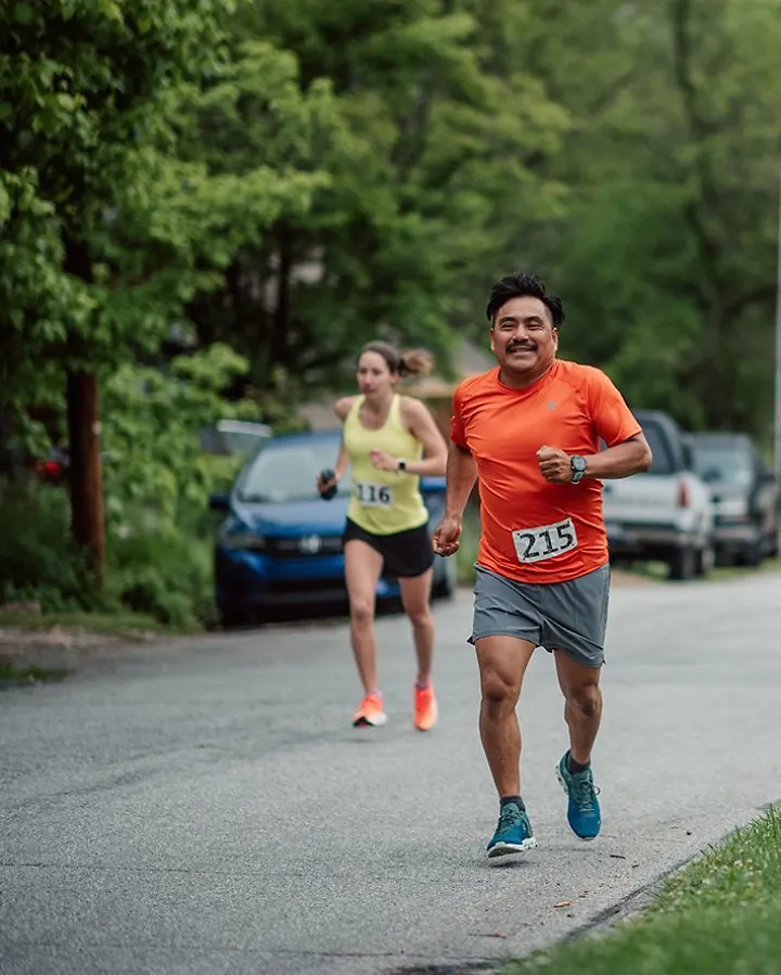 A man and woman race eachother.