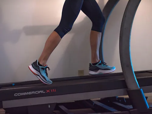 A runner runs on the treadmill instead of running outside.