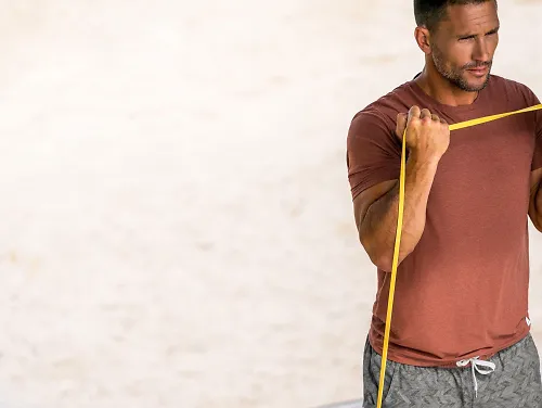 A man works out in Vuori apparel. 