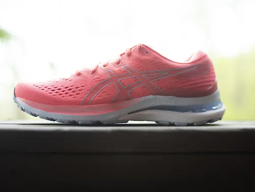 Women's Kayano 28 in bright coral pink. 