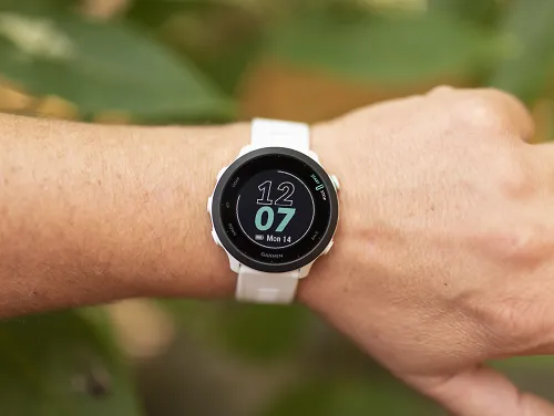 A runner wears the Garmin Forerunner 55 watch