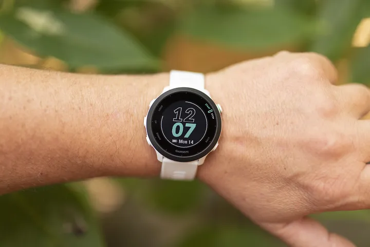 A runner wears the Garmin Forerunner 55 watch
