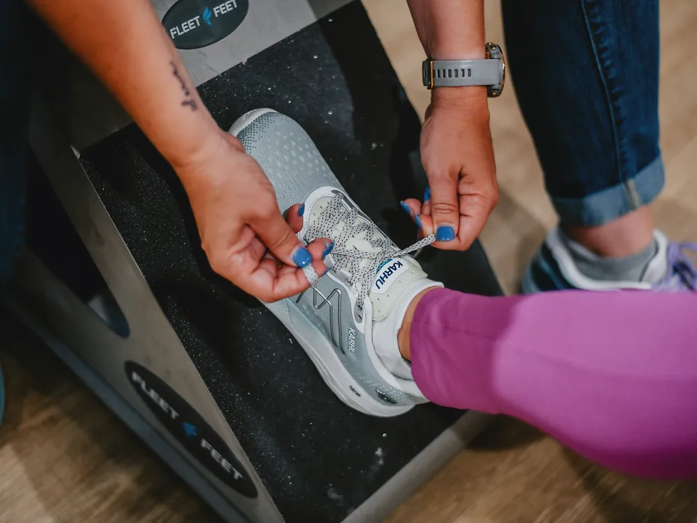 A woman gets fit at Fleet Feet and learns how running shoes should fit.