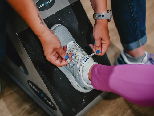A woman gets fit at Fleet Feet and learns how running shoes should fit.