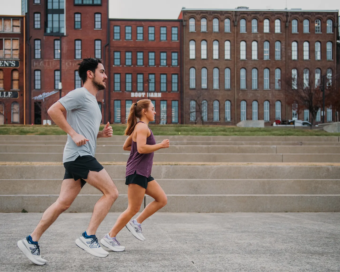 A man and woman run in the Fleet Feet exclusive colors of the 880V15. 