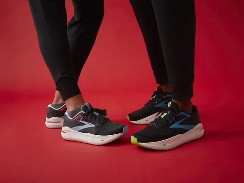 Two people standing wearing Brooks Ghost Max