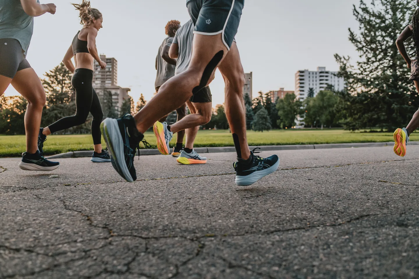 A group of runners run at dawn.