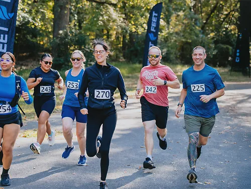 men and women running a fleet feet race