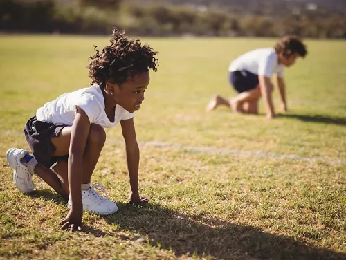 A young child lines up to run a race