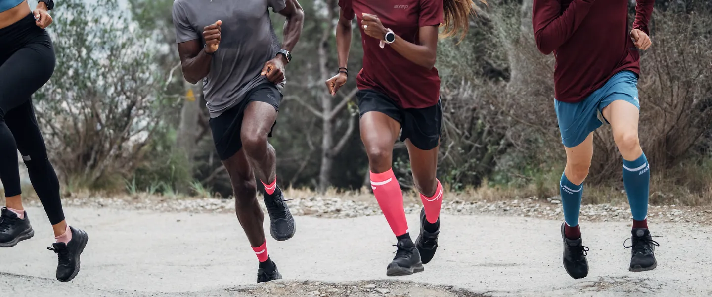 Four runners take off in CEP 4.0 socks of different lengths