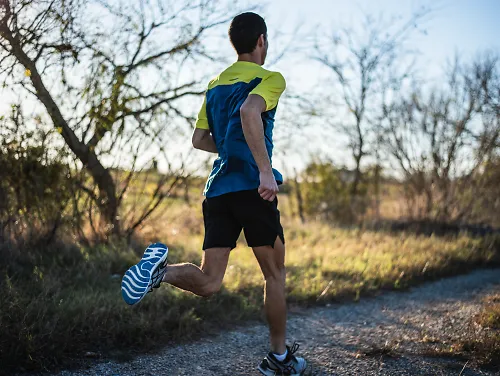 Professional runner Diego Estrada runs on a path