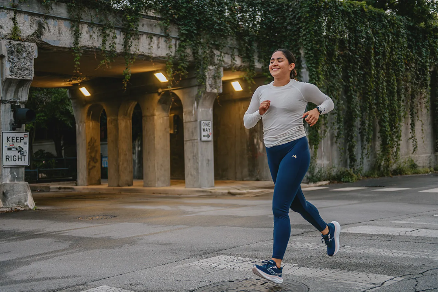 Woman running on cross walk