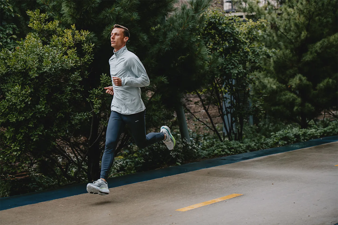 Man running on sidewalk