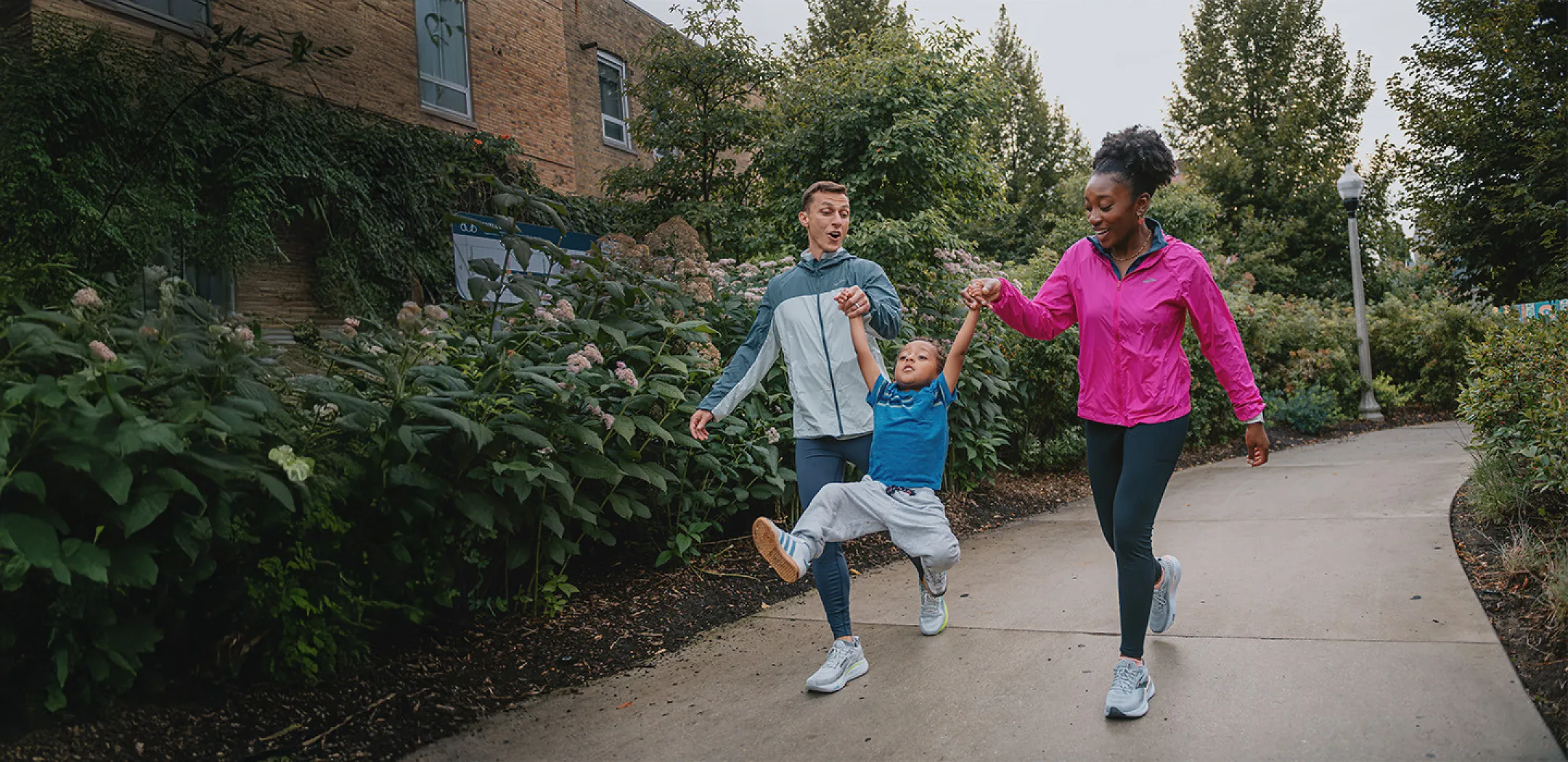 Husband and wife walking with child