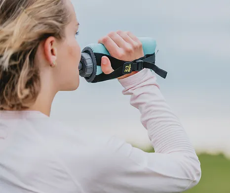 Runner drinking from amphipod water bottle