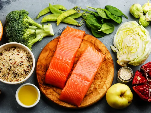An array of healthy food, including vegetables, fruits and fish
