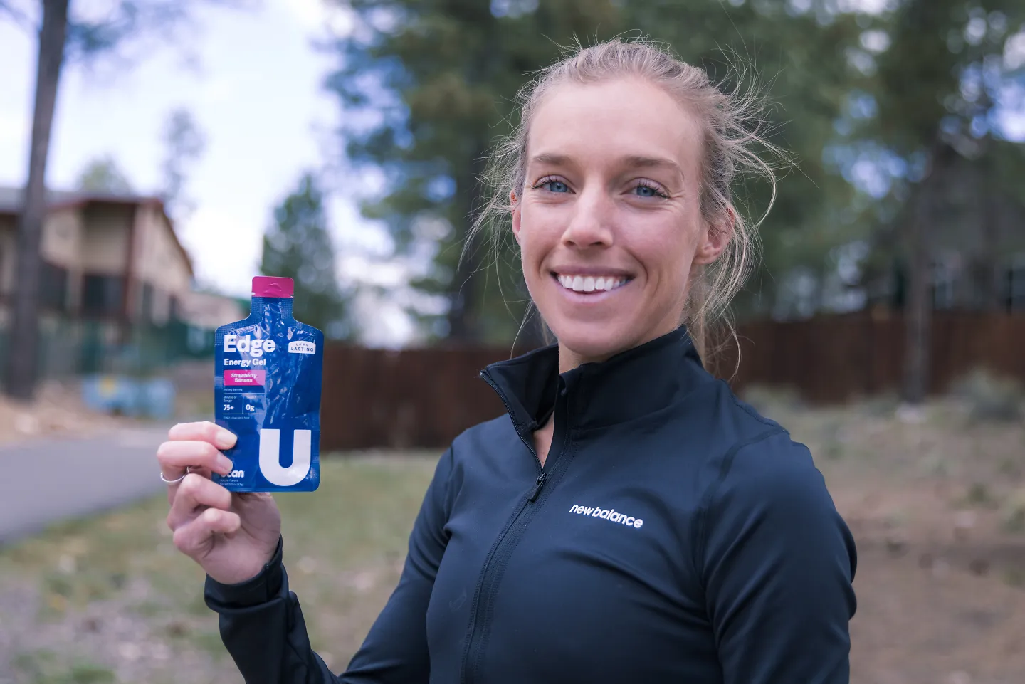 Emily Sisson smiles with a UCAN gel. 