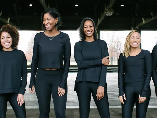 The six co-founders of RUNGRL stand side by side, smiling
