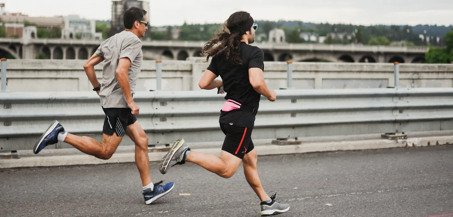 Two men race each other