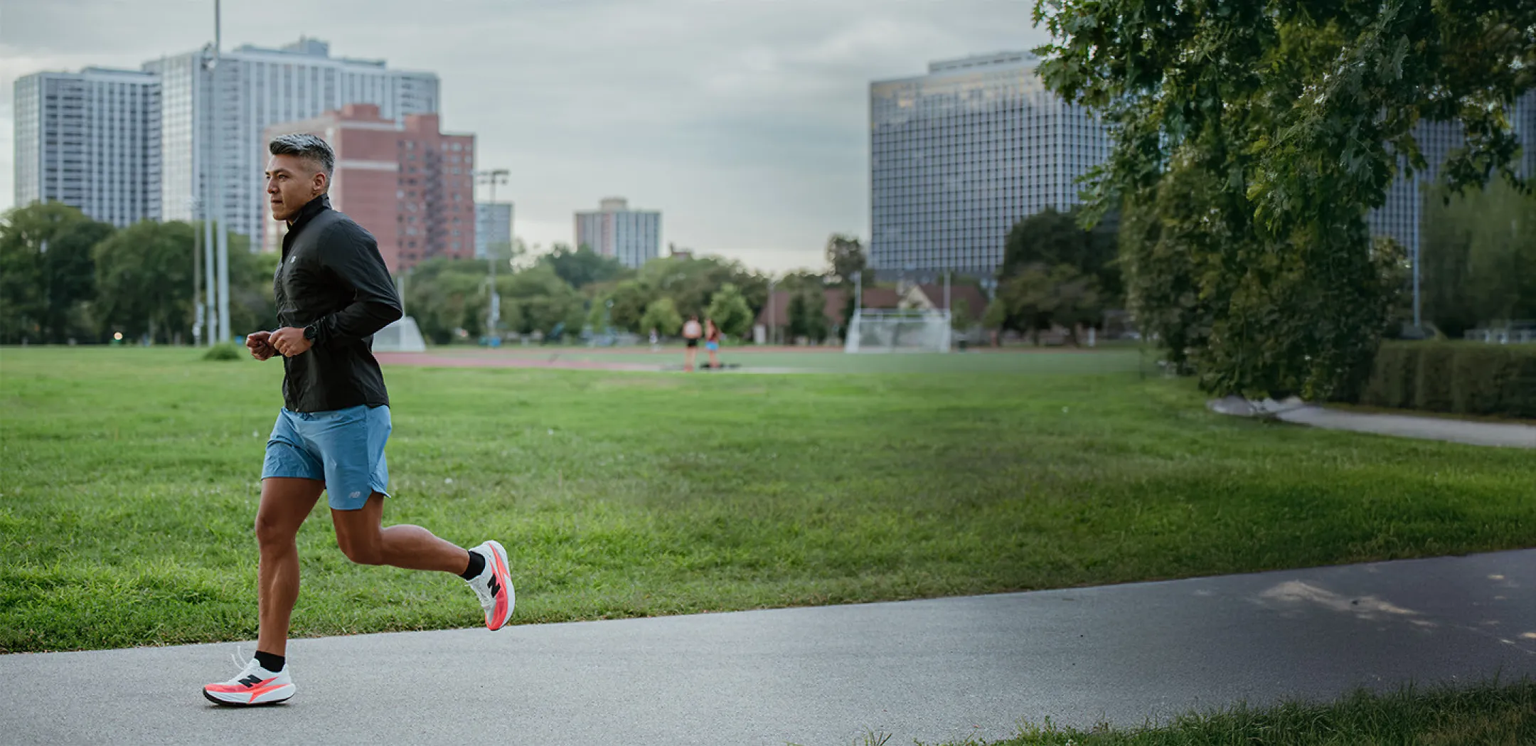 Man running in city park