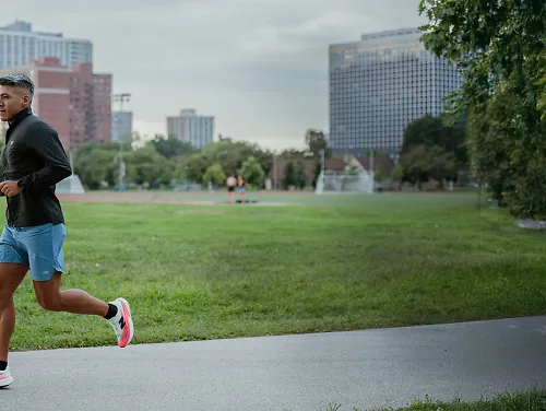 Man running in city park