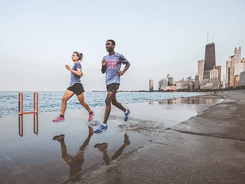Two people run in Mizuno's Project Zero Waveknit R2