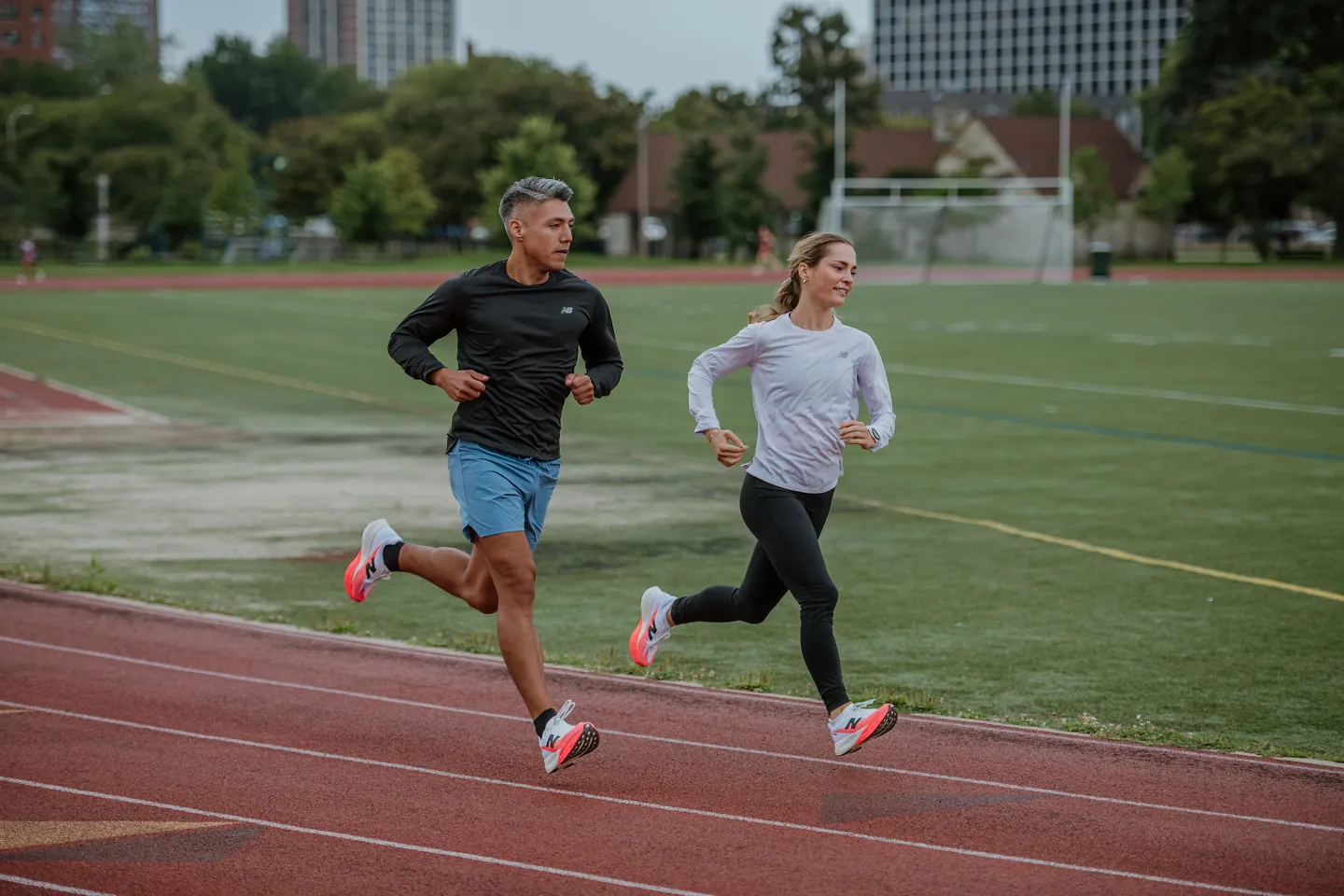 Runners race around a track.