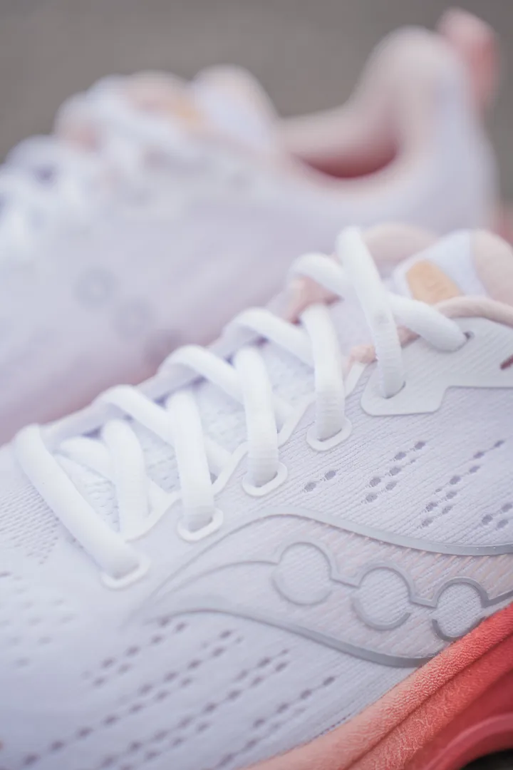 Up-close photo of white Saucony shoe