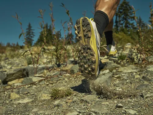 A runner runs in the Saucony Peregrine.