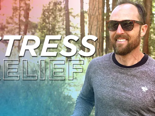 Coach Nate smiles during a trail run.