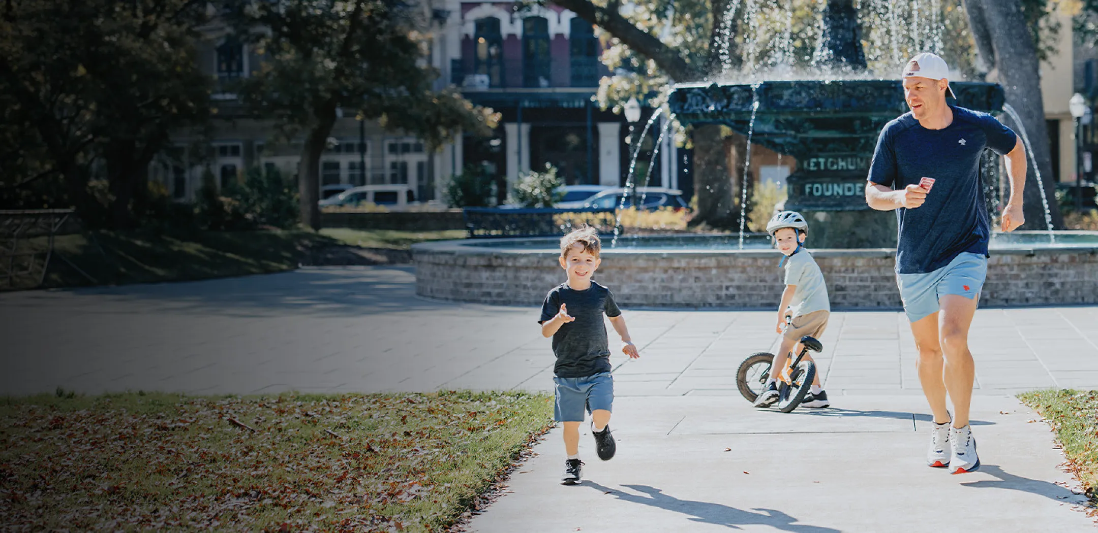 Father running with two sons