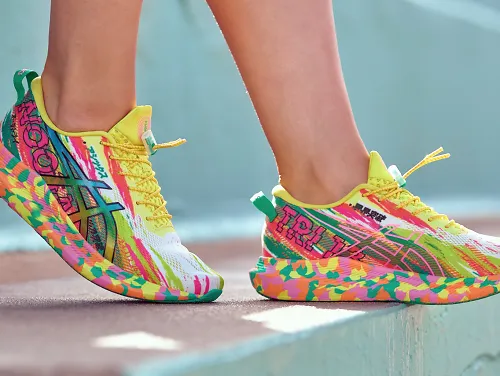 A woman wearing the ASICS GEL-Noosa Tri 13