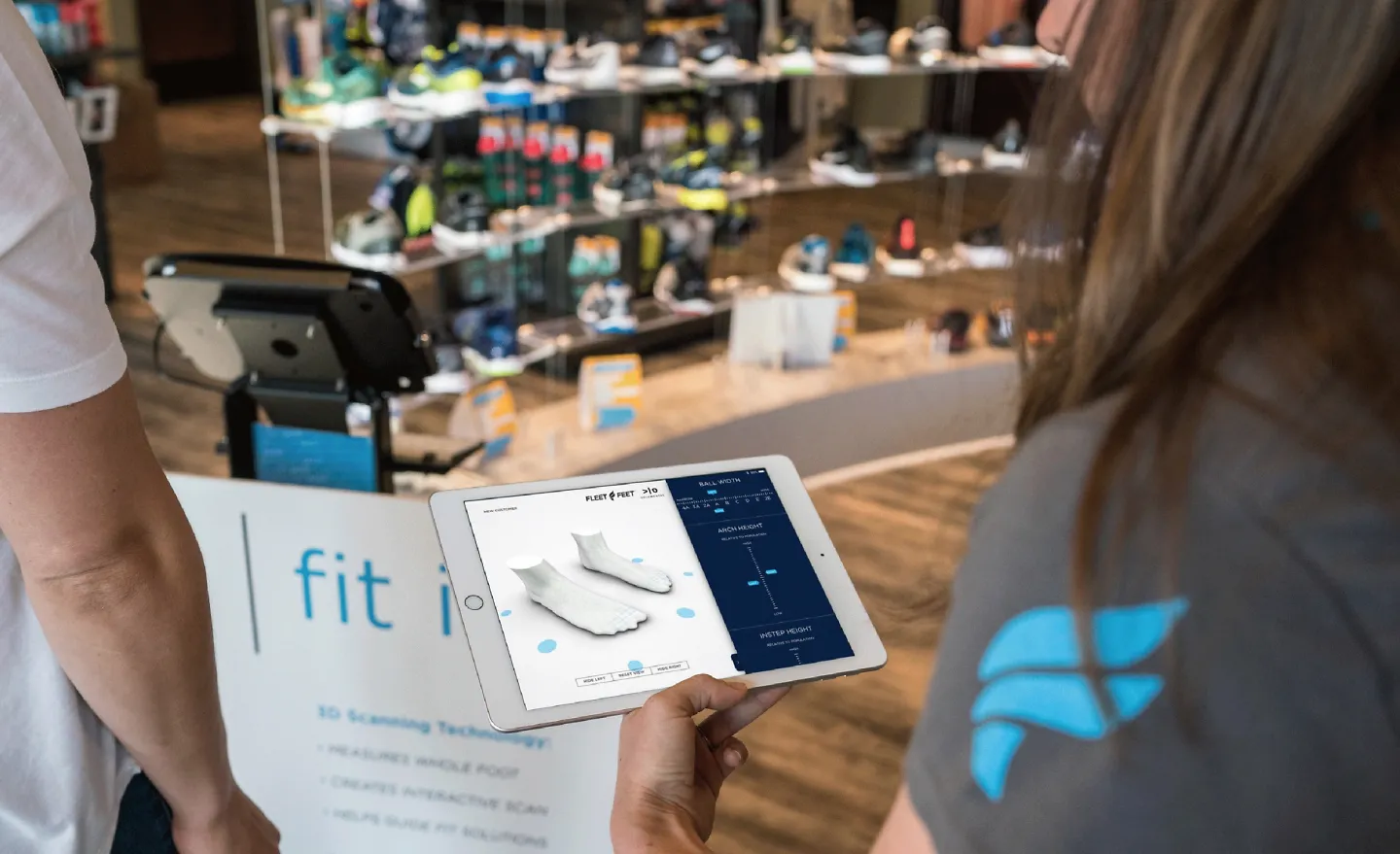A customer gets scanned to find the best running shoes