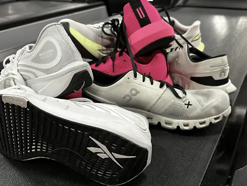 Best treadmill running shoes are shown sitting on a treadmill