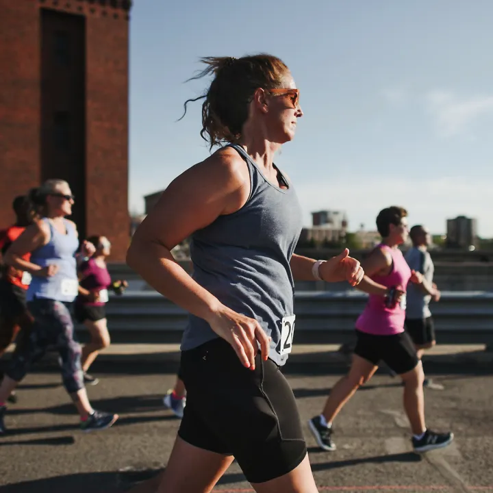 Runners run together in a Fleet Feet training group