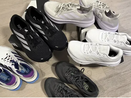 four pairs of adidas shoes