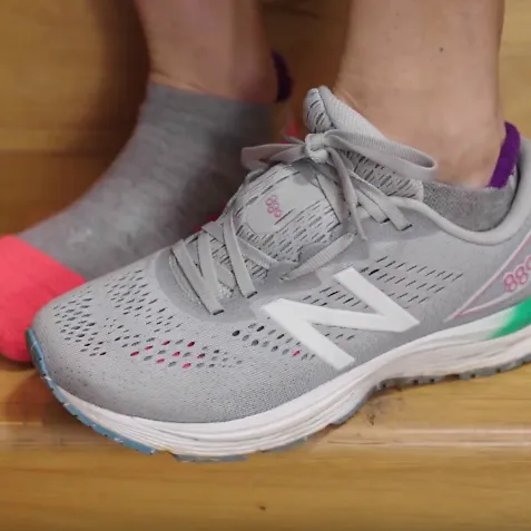 A runner demonstrates the high instep lacing technique